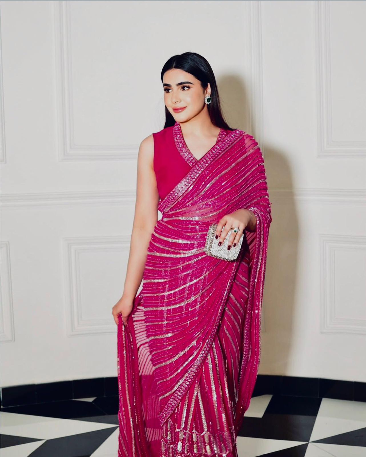 Wrapped in pink dipped in shine sequins saree