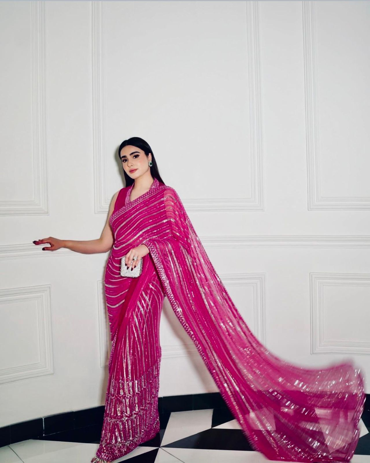 Wrapped in pink dipped in shine sequins saree