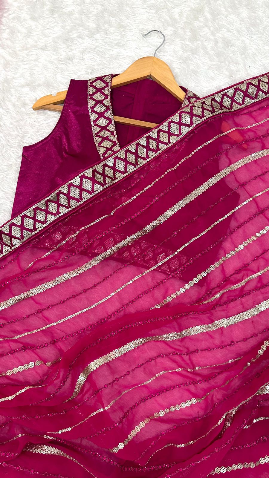 Wrapped in pink dipped in shine sequins saree