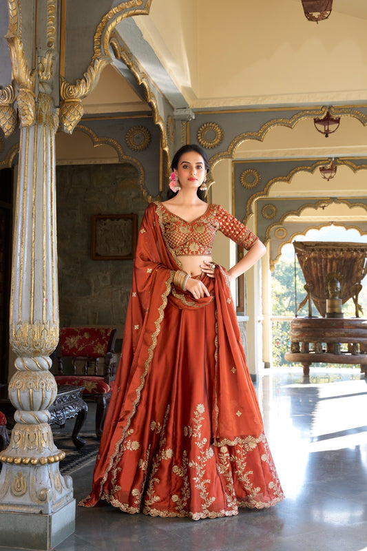 Draped in rust glowing in gold premium lehenga