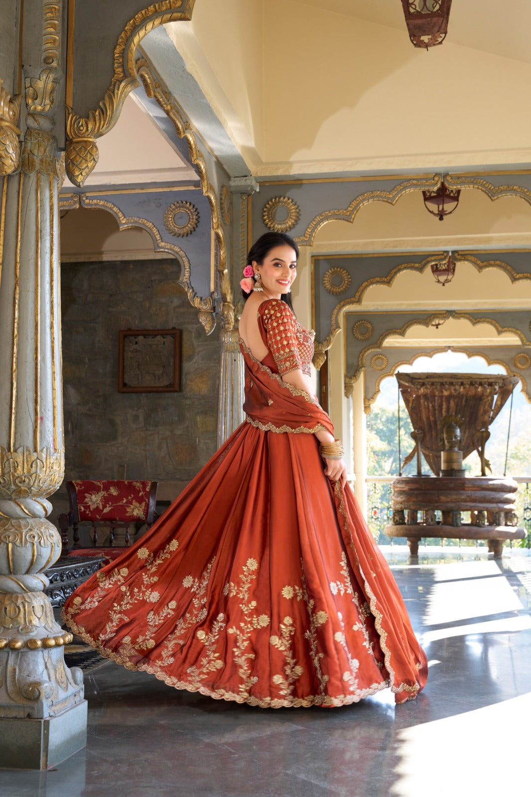 Draped in rust glowing in gold premium lehenga
